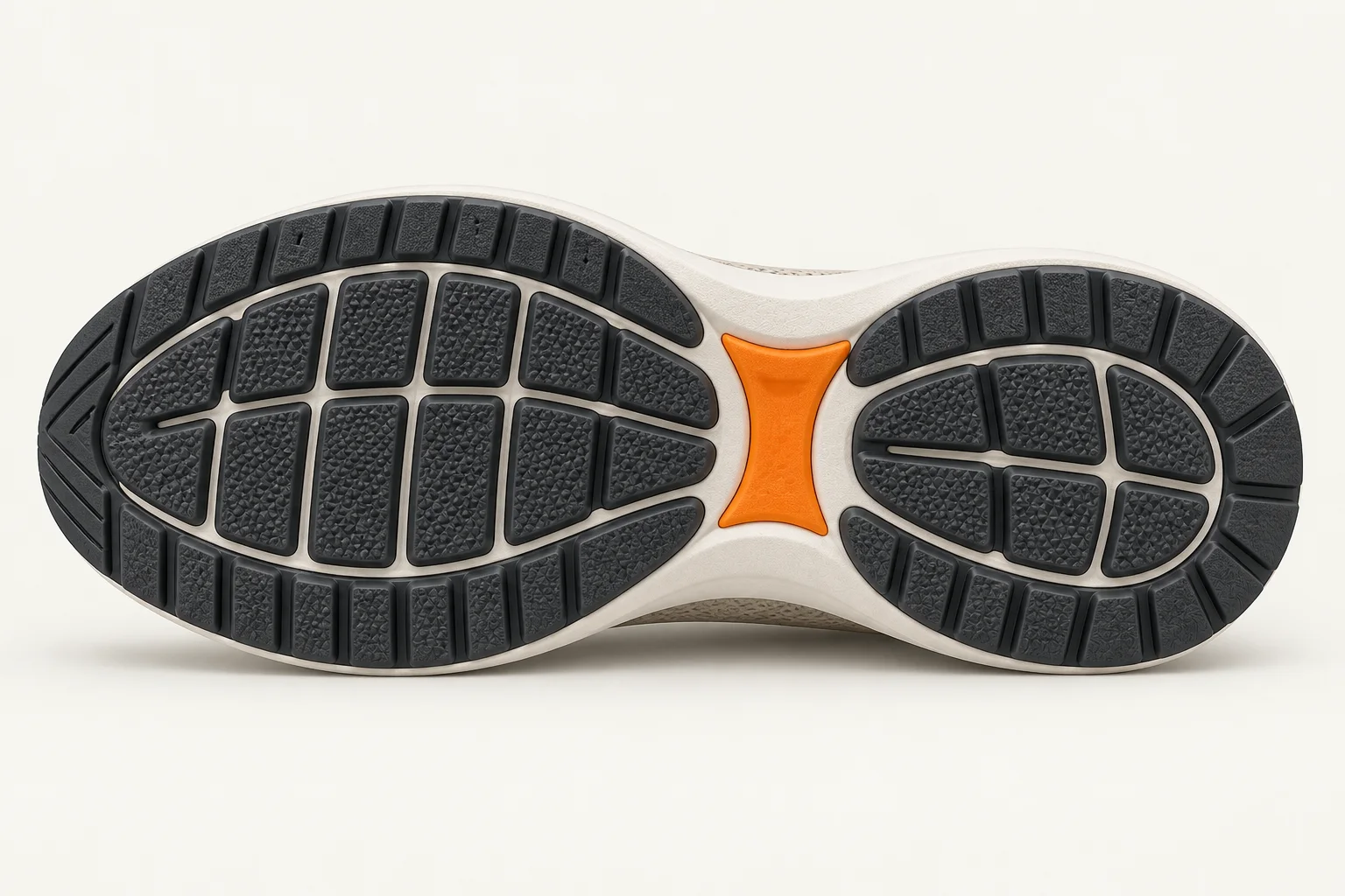 Textured charcoal tread, cream channels and an orange arch insert. A different view of the same clean silhouette.